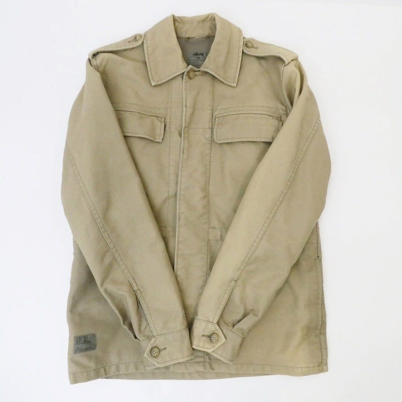 【中古】STUSSY | ステューシー MIL SPEC TRIBE WORLDWIDE RESPECT ミリタリージャケット ベージュ サイズ:S