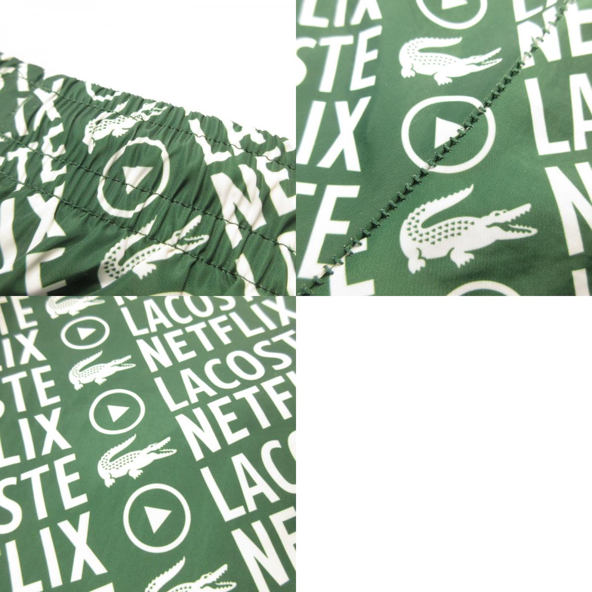 【中古】LACOSTE | ラコステ 耐水総柄トラックパンツ パンツ XH9342 xNetflix グリーン サイズ:S