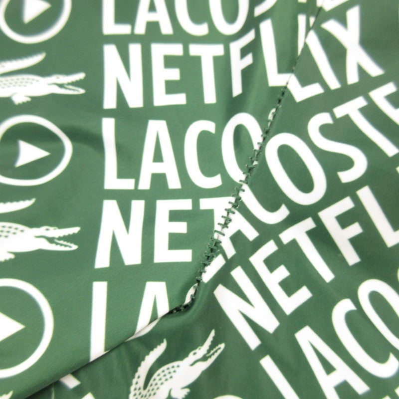【中古】LACOSTE | ラコステ 耐水総柄トラックパンツ パンツ XH9342 xNetflix グリーン サイズ:S
