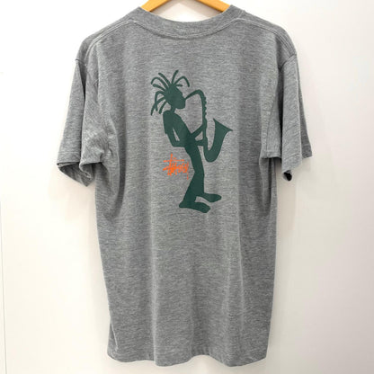 【中古】STUSSY | ステューシー ジャズマン 紺タグ　半袖Ｔシャツ グレー サイズ：L【尾張小牧店】