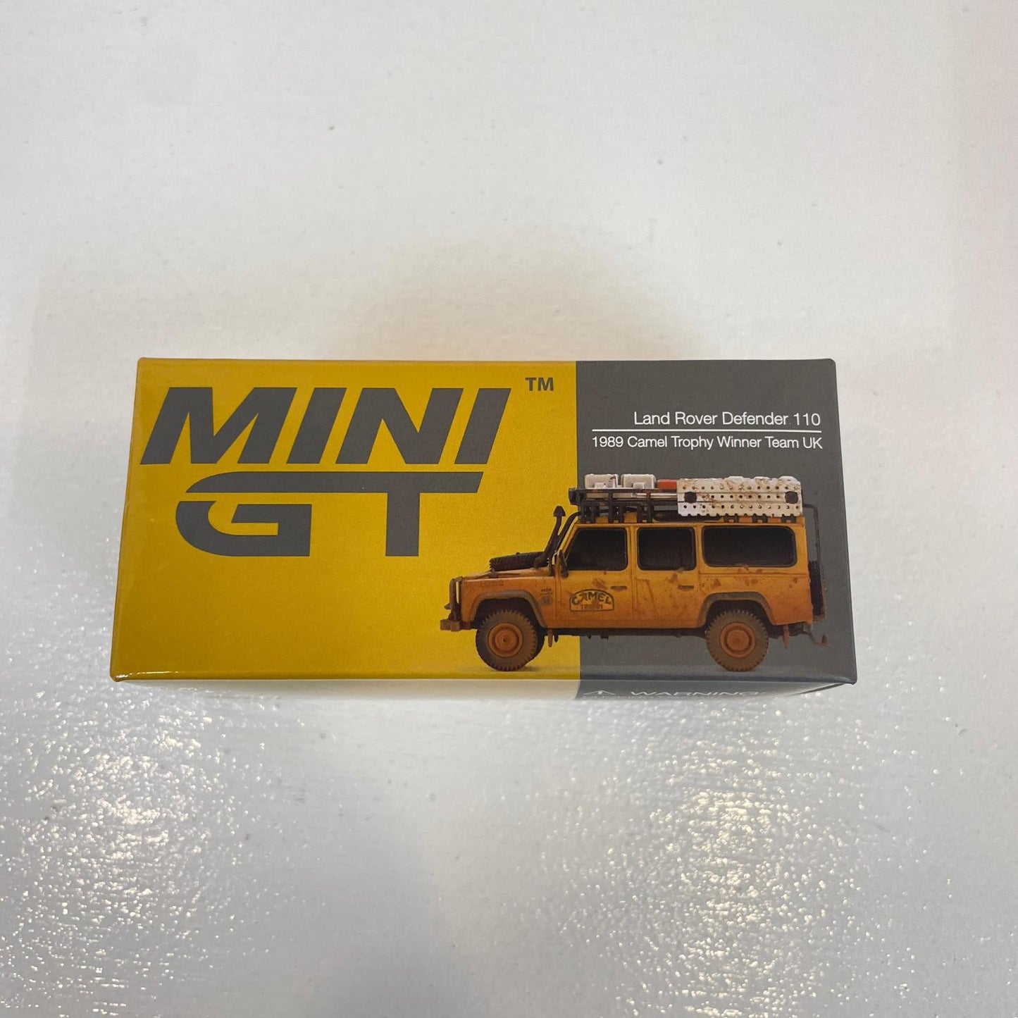 MINI GT 1/64 ランドローバー ディフェンダー 1989 キャメルトロフィー 優勝車 UKウェザリング塗装【尾張小牧店】