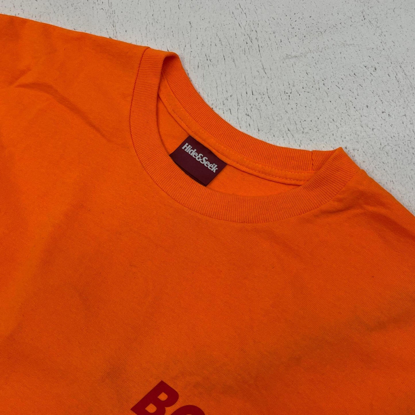 HIDE AND SEEK | ハイドアンドシーク racing l/s tee 長袖Ｔシャツ オレンジ サイズ：XL【加古川店】