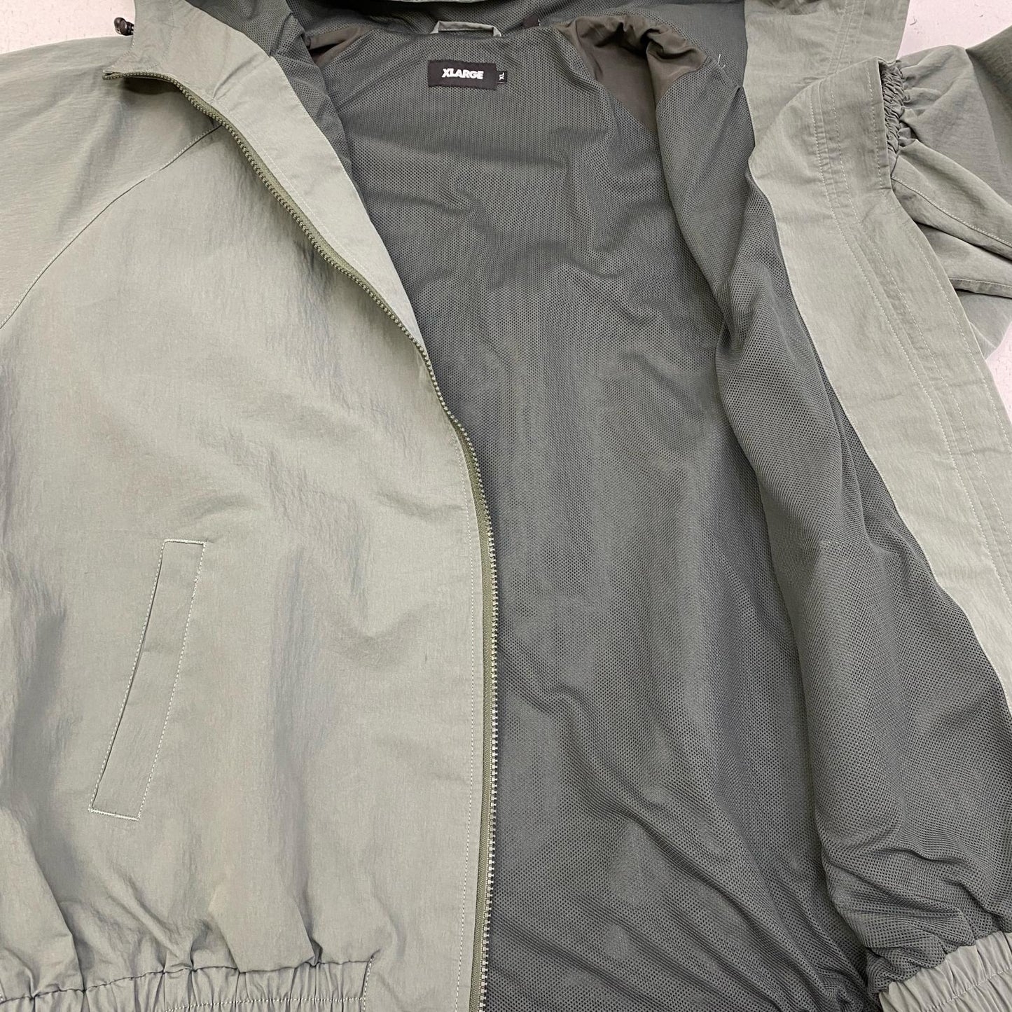 【中古】X-LARGE | エクストララージ RAGLAN HOODED JACKET ナイロンジャケット 101253021004 カーキ サイズ：XL【加古川店】