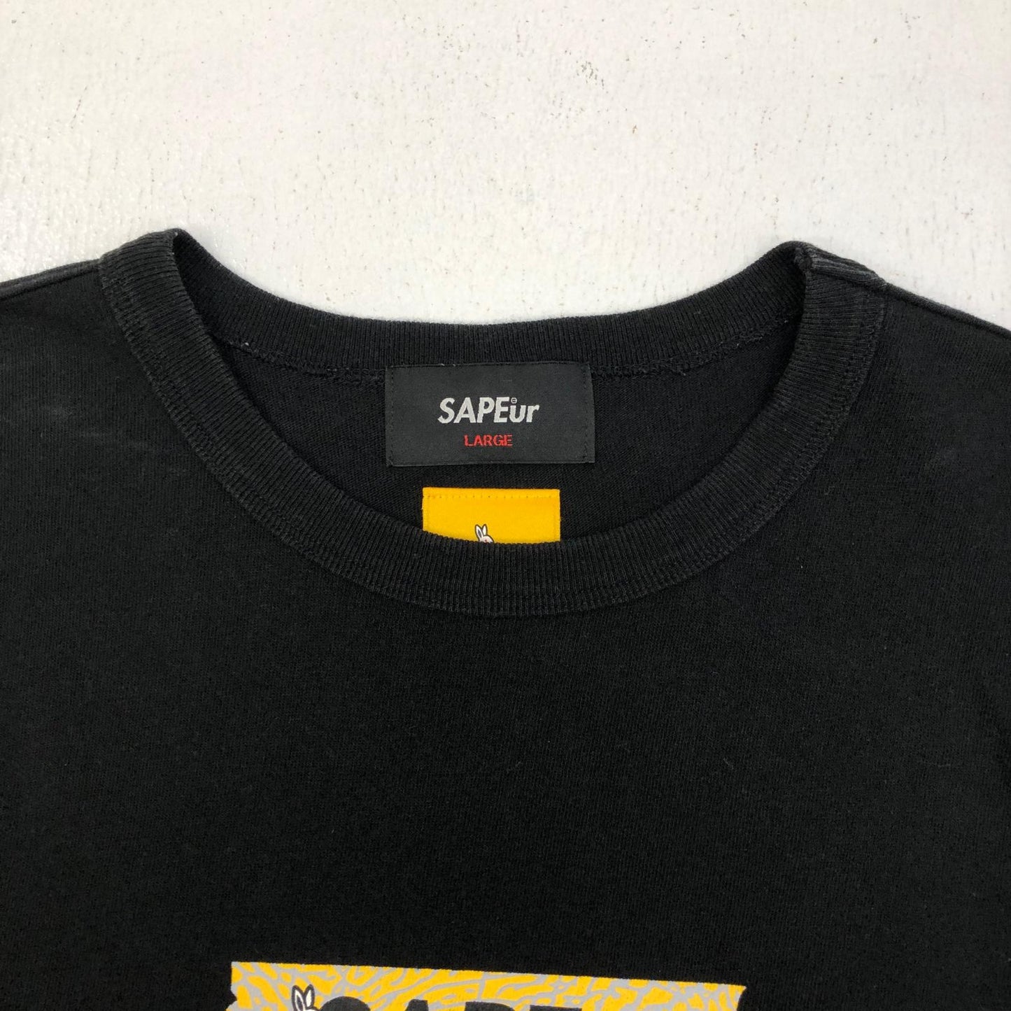 【中古】A Elegantes SAPEur | アエレガンスサプール SMOKING KILLS HEAD 半袖Ｔシャツ ブラック サイズ：L【加古川店】