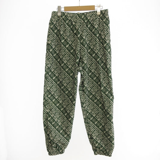 【中古】LACOSTE | ラコステ 耐水総柄トラックパンツ パンツ XH9342 xNetflix グリーン サイズ：S