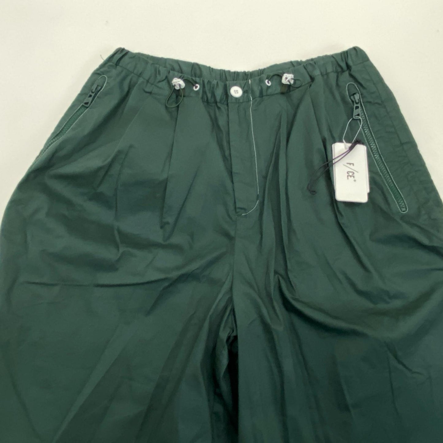 F/CE. | エフシーイー SOLOTEX PIGMENT-DYE LAYERED TROUSERS パンツ FPU03241M0001 ナイロンパンツ グリーン サイズ：M【姫路東店】