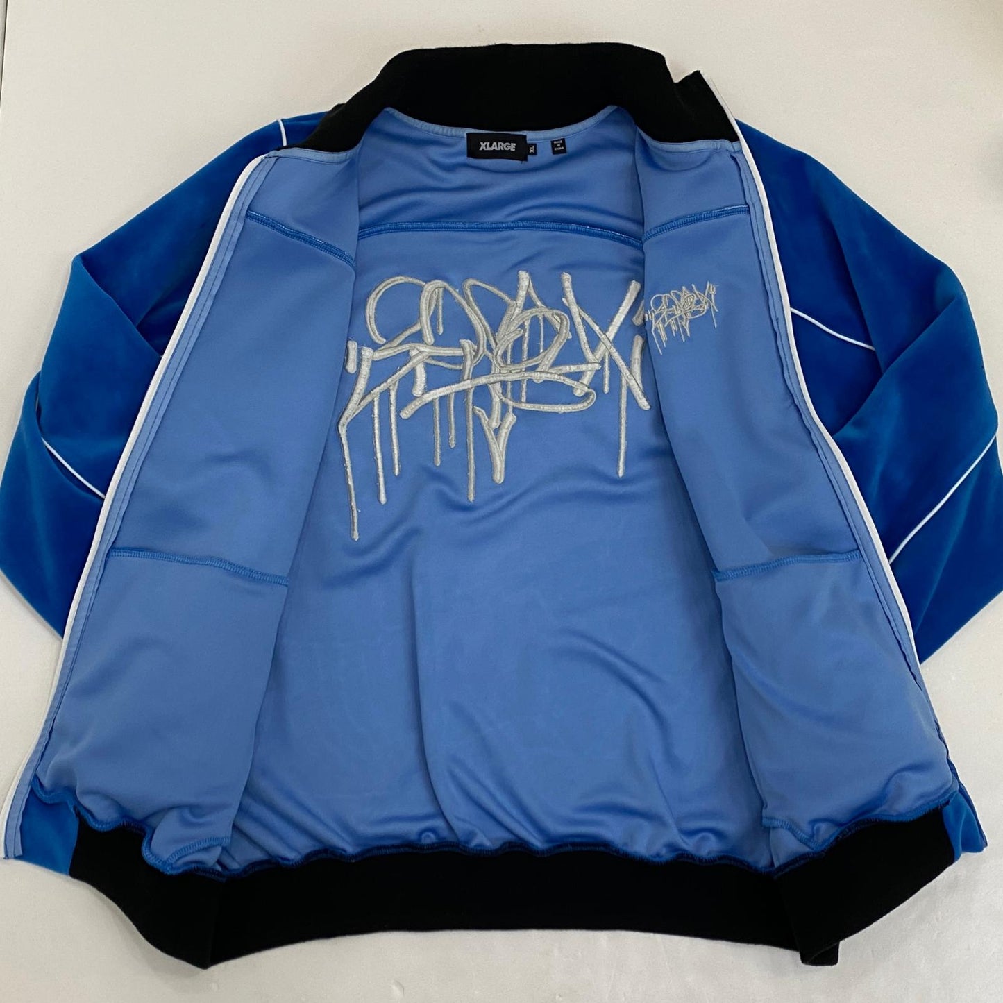 X-LARGE | エクストララージ TAGGING VELOUR JACKET ジャージ 101253021009 ブルー サイズ：XL【姫路東店】