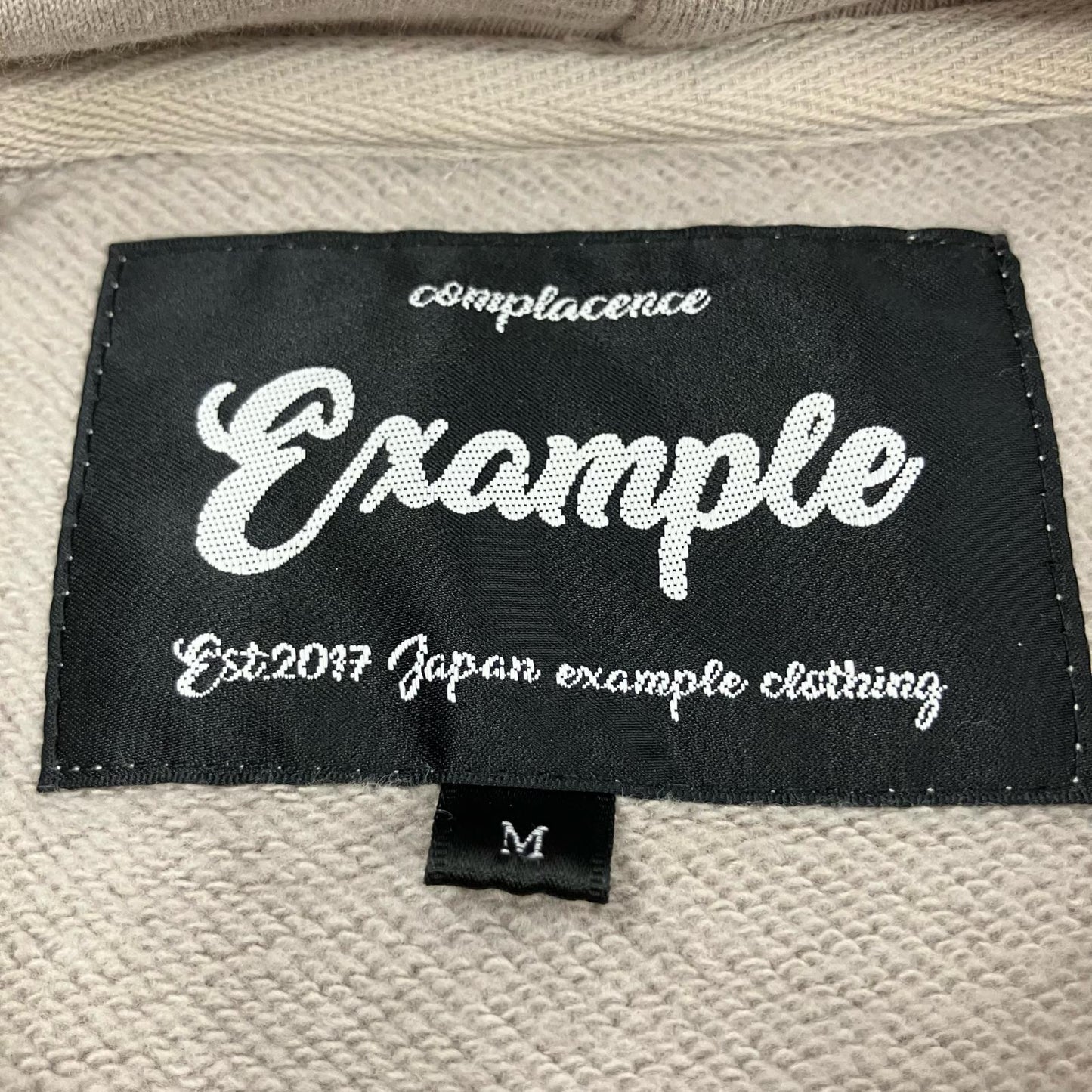 EXAMPLE | イグザンプル ROUND LOGO HOODIE パーカー ベージュ サイズ：M【イオン広店】