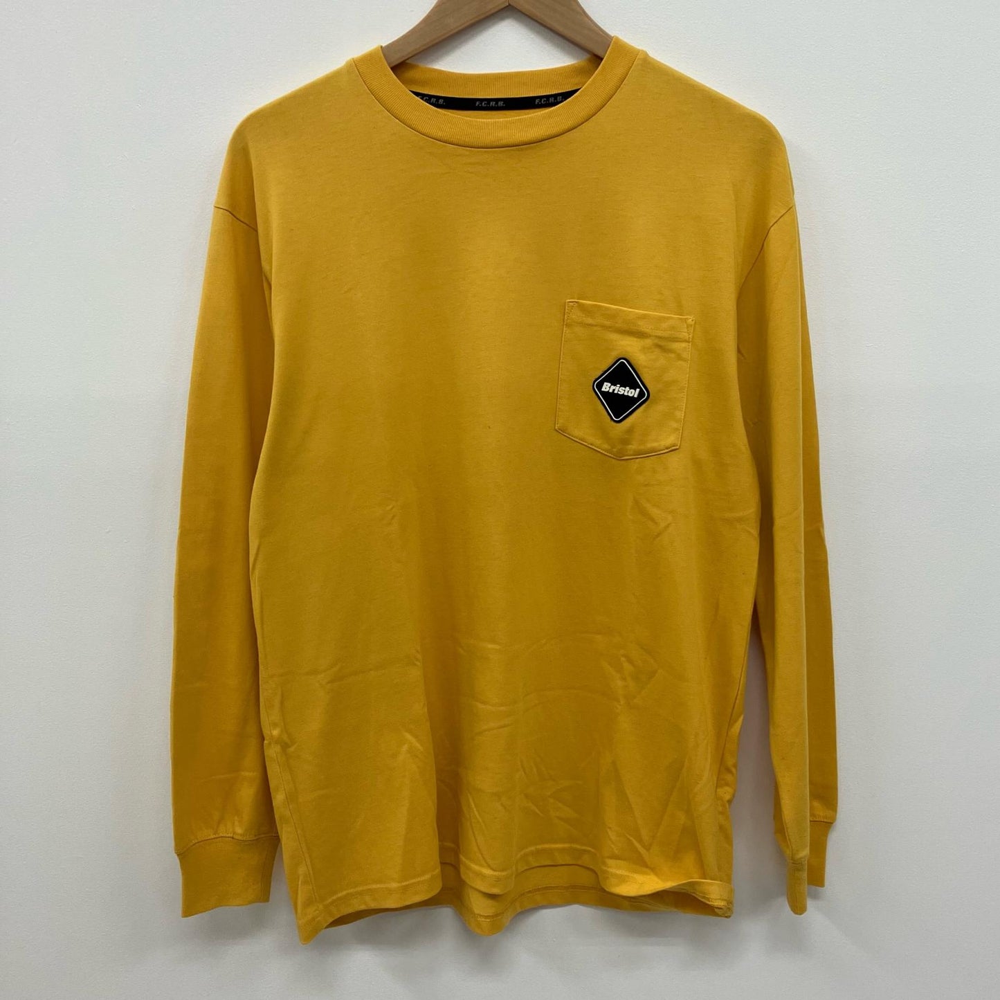FCRB | エフシーアールビー L/S AUTHENTIC TEAM POCKET TEE 長袖Ｔシャツ FCRB-222073 イエロー サイズ：M【イオン広店】