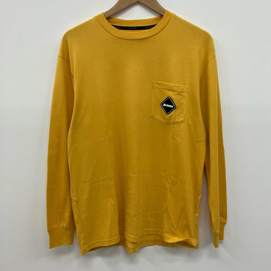 FCRB | エフシーアールビー L/S AUTHENTIC TEAM POCKET TEE 長袖Ｔシャツ FCRB-222073 イエロー サイズ：M【イオン広店】