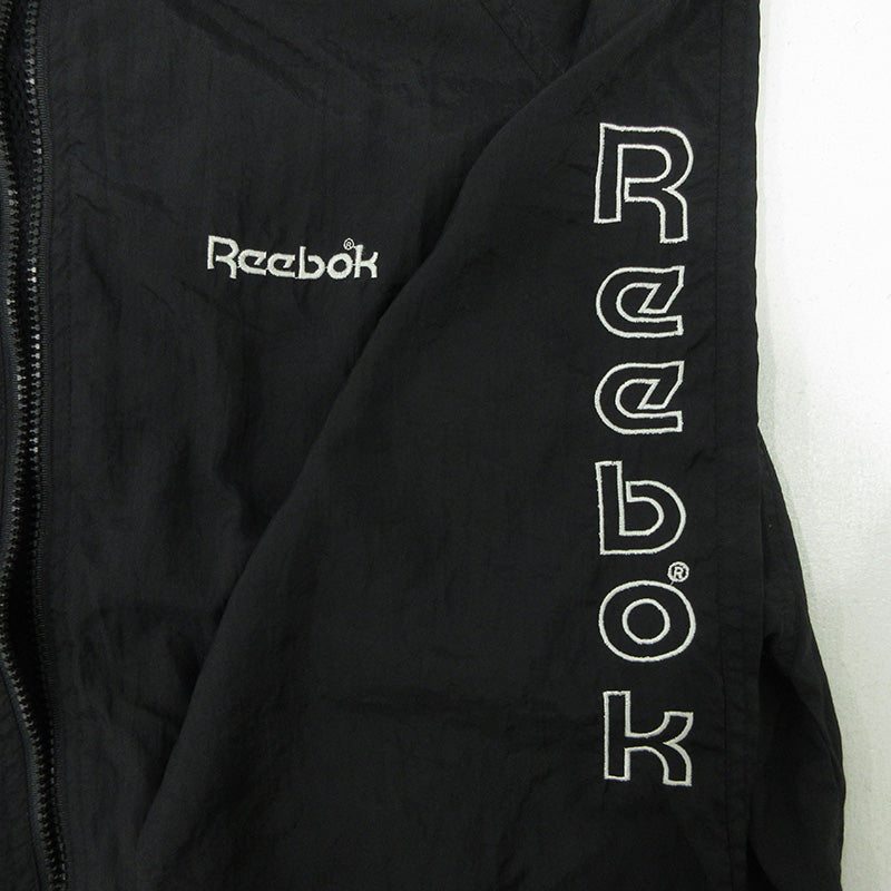 Reebok | リーボック その他アウター リーボック スタンドカラー 袖刺繍入り 切り替え ナイロンジップジャケット白黒 XL 長袖 ブラック サイズ：M【三重本店】