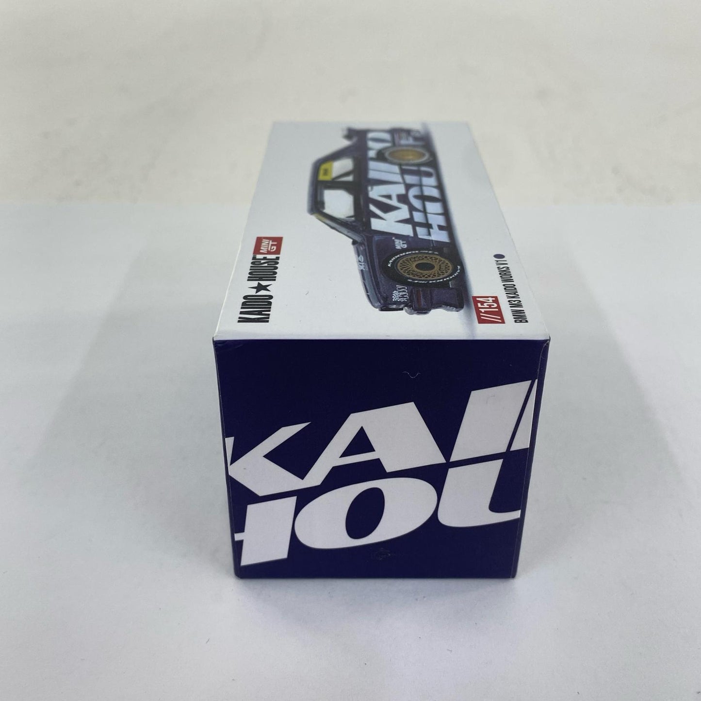 1/64 BMW M3 (E30) Kaido Works V1 (Left-Hand Drive) "KAIDO HOUSE x MINI GT Series" [KHMG154]