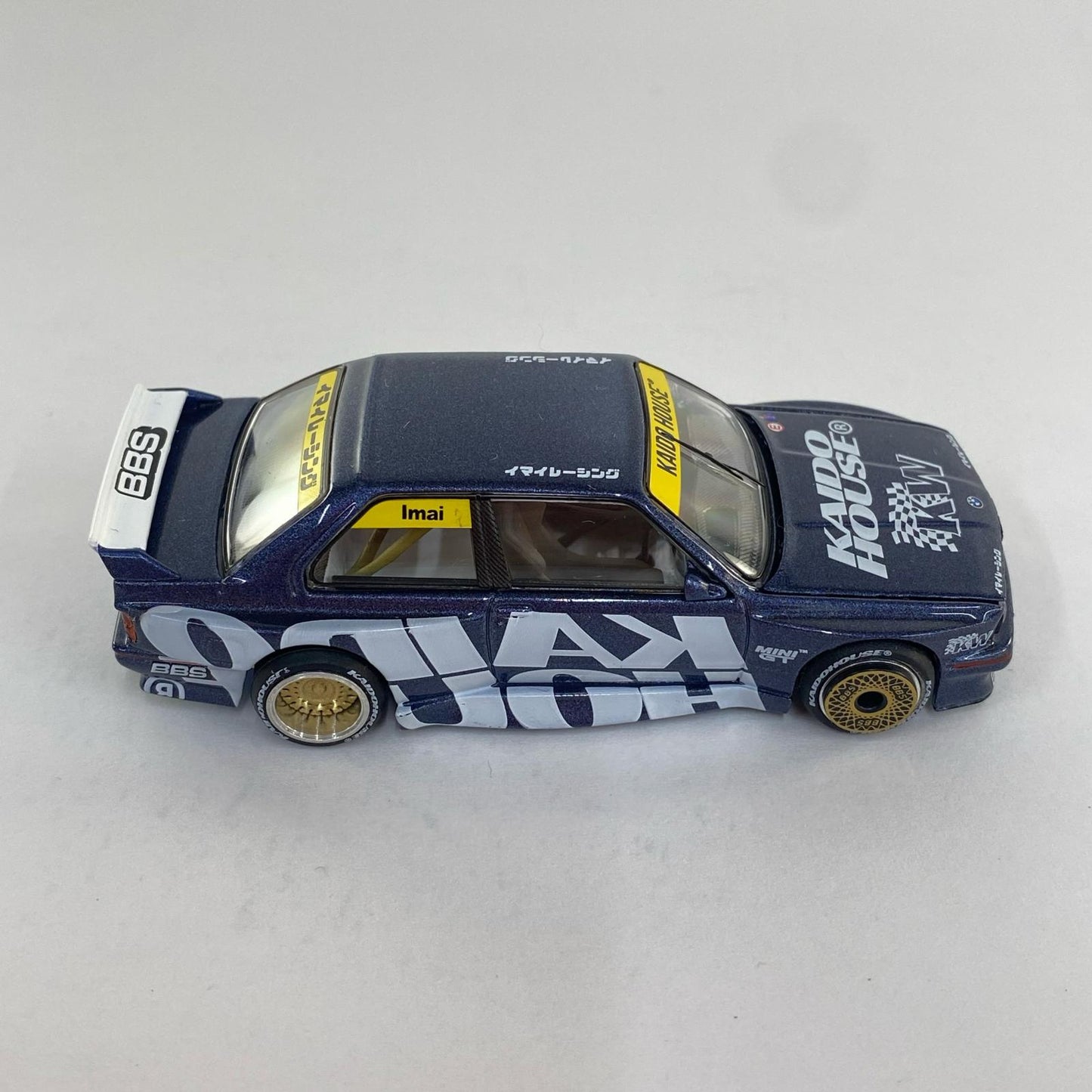 1/64 BMW M3 (E30) Kaido Works V1 (Left-Hand Drive) "KAIDO HOUSE x MINI GT Series" [KHMG154]