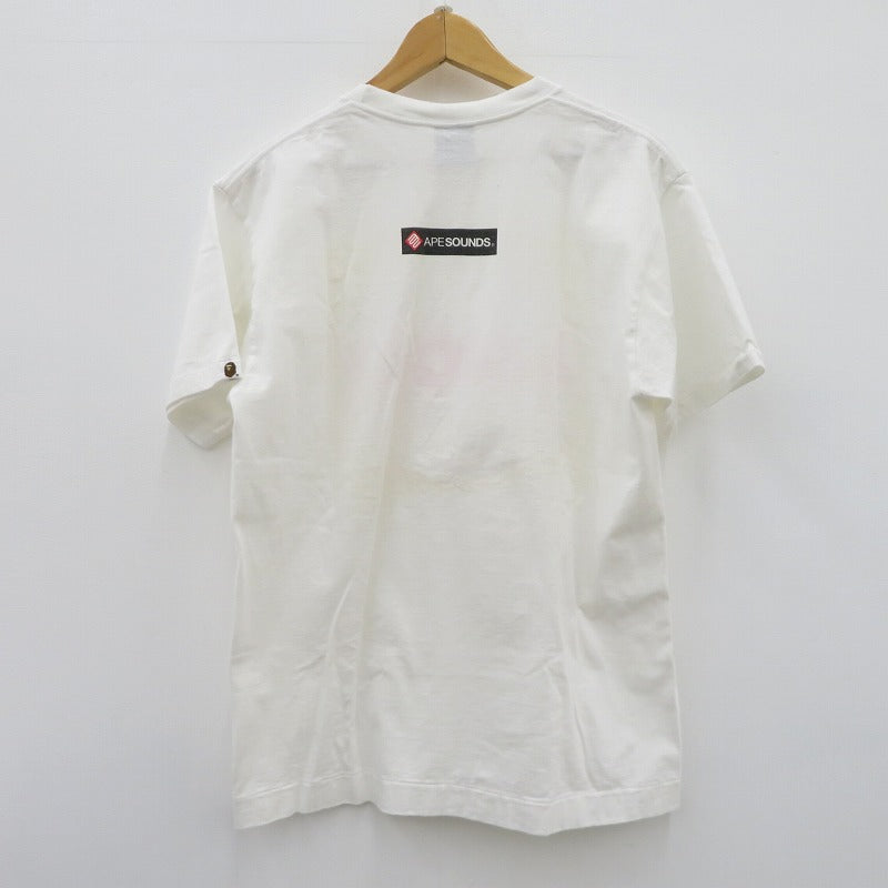 A BATHING APE | アベイシングエイプ ｹﾞｰﾑﾀｸﾞ NIGOﾛｺﾞ 半袖Ｔシャツ ホワイト サイズ：L【瀬戸大橋店】