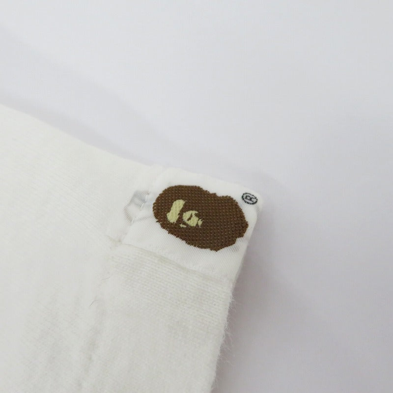 A BATHING APE | アベイシングエイプ ｹﾞｰﾑﾀｸﾞ NIGOﾛｺﾞ 半袖Ｔシャツ ホワイト サイズ：L【瀬戸大橋店】